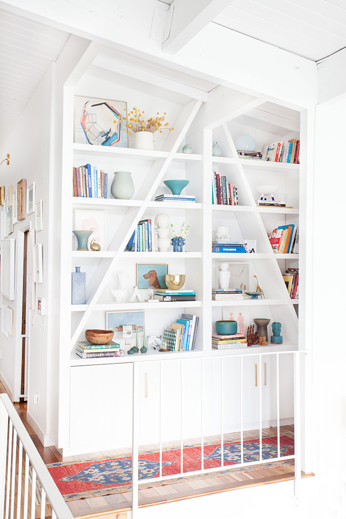 Emily Henderson Bookcase midcentury modern clean white accessories