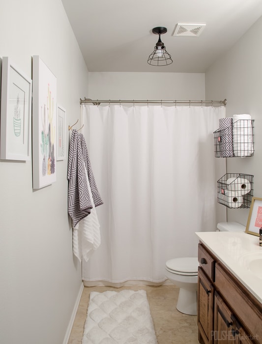 Budget Bathroom Refresh - This guest bathroom went from boring beige to organized modern industrial style in one weekend for under $300. 