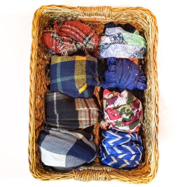 Scarves in balls in wicker basker